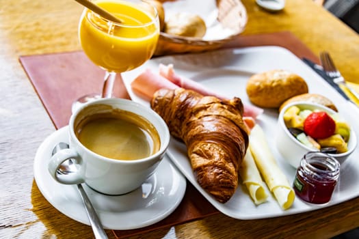 Breakfast served with coffee, orange juice and croissants.
