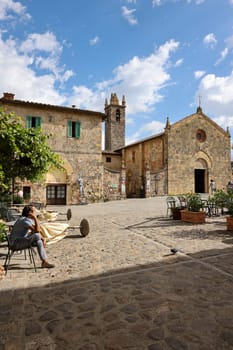 Monteriggioni, Italy - Sept 17, 2022: Piazza Roma in Monteriggioni medieval walled town. Tuscany, Italy