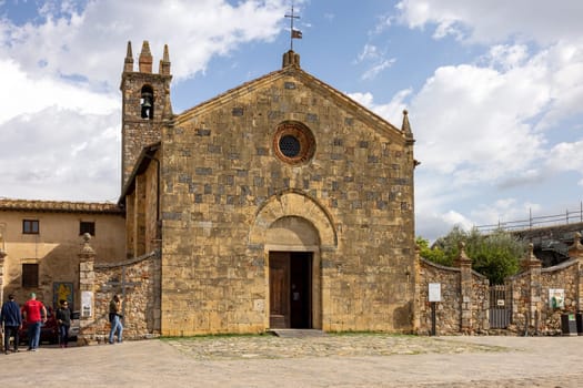 Monteriggioni, Italy - Sept 17, 2022: Old Church of Holy Mary of the Assumption in Monteriggioni village in Tuscany near Siena. Italy