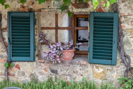 Monteriggioni, Italy - Sept 17, 2022: Old stone house in Monteriggioni medieval walled town near Siena in Tuscany, Italy