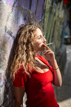 pensive young woman with cigarette