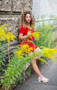 pensive young woman standing on the street