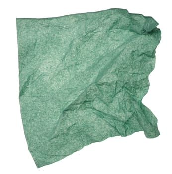 Green crumpled paper napkin on isolated background, close up