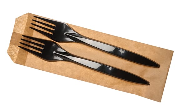 Plastic black forks and paper envelope on isolated background, top view