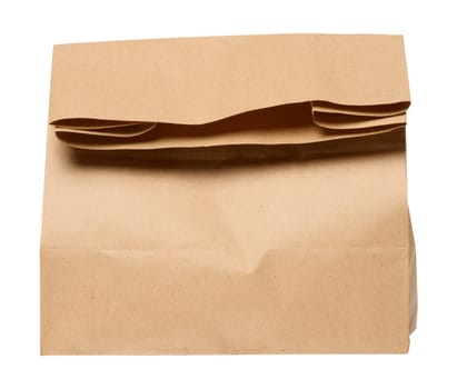 A large empty brown kraft paper bag for packaging products in stores on an isolated background