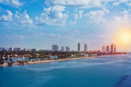 Beautiful aerial panoramic view of the city of Miami from Port of Miami. The MacArthur Causeway with Palm Island and South Beach buildings in the background in Miami, Florida.