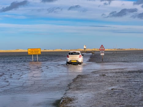 The causeway to Lindisfarne on Holy Island off the coast of Northumberland in northeast England. Only passable at low tide.