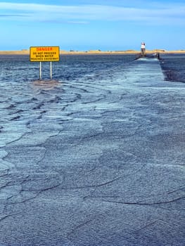 The causeway to Lindisfarne on Holy Island off the coast of Northumberland in northeast England. Only passable at low tide.