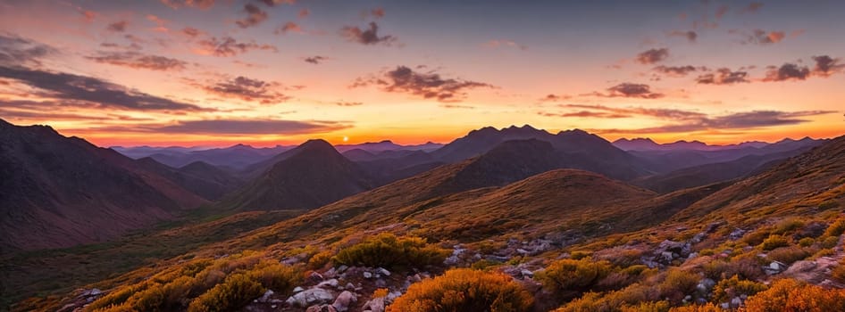 Rugged beauty of a mountain range at golden hour, with the sun setting in the background painting the sky in hues of orange and pink