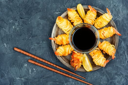 Fried rolled potato shrimps, prawns and potato rolls. Popular Asian food. Vietnamese cuisine. Space for text.
