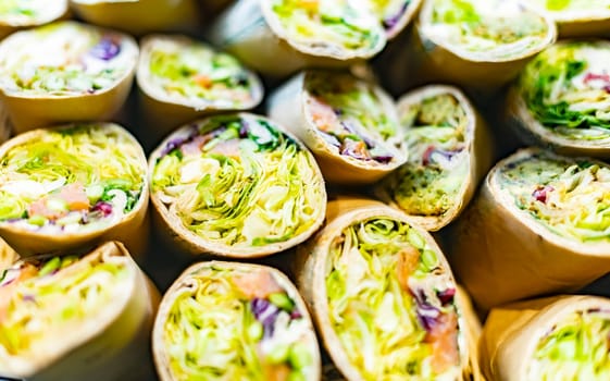 Freshly prepared tortilla wraps sold in a fast food restaurant.