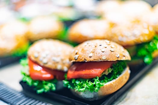 Freshly prepared sandwiches sold in a fast food restaurant.