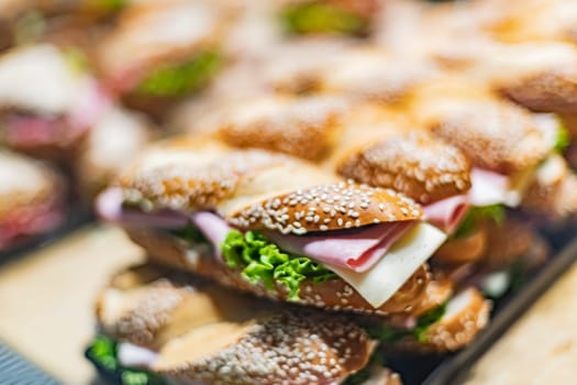 Freshly prepared sandwiches sold in a fast food restaurant.