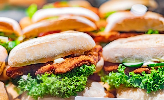 Freshly prepared sandwiches sold in a fast food restaurant.