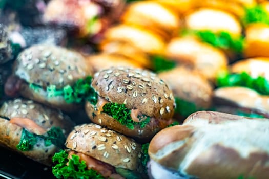 Freshly prepared sandwiches sold in a fast food restaurant.