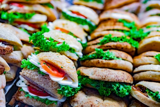 Freshly prepared sandwiches sold in a fast food restaurant.