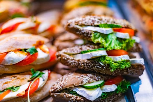Freshly prepared sandwiches sold in a fast food restaurant.
