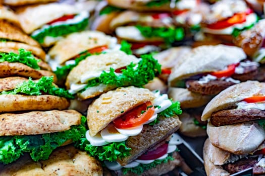 Freshly prepared sandwiches sold in a fast food restaurant.