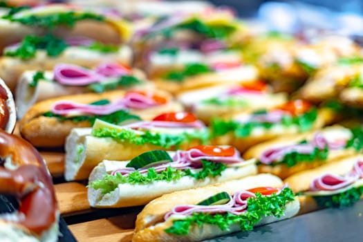 Freshly prepared sandwiches sold in a fast food restaurant.