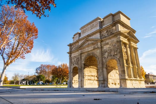 Famous Roman triumphal arch, historical building in Orange city, in the Vaucluse department in the Provence-Alpes-Côte d'Azur region in southeastern. photography taken in France