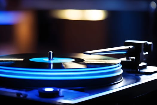 Close-up of a record player in blue light