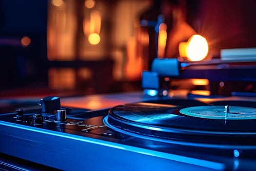 Close-up of a record player in blue light