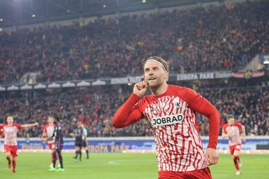 Lucas Höler (SC Freiburg) celebrates his goal to equalize 2:2 in the match of the 1. FBL: 23-24: 24. Sptg. SC Freiburg - FC Bayern Munich  DFL REGULATIONS PROHIBIT ANY USE OF PHOTOGRAPHS AS IMAGE SEQUENCES AND/OR QUASI-VIDEONann  Photo: Joachim Hahne/johapress