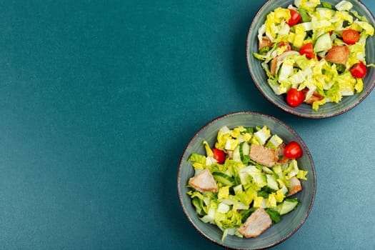Homemade salad of fresh vegetables, herbs and fried meat. Healthy diet. Top view.