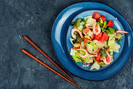 Tasty salad with pomelo, shrimps and greens. Thai appetizer salad.