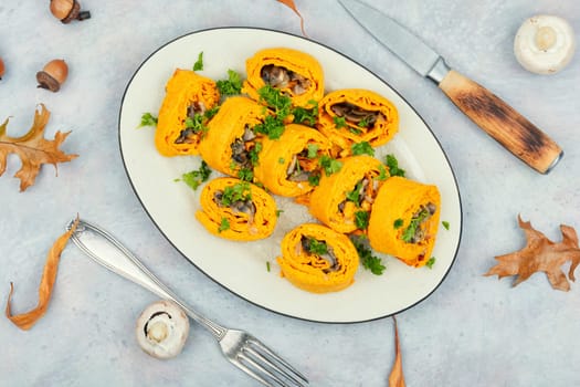 Delicious pumpkin dough rolls stuffed with mushrooms on vintage table.
