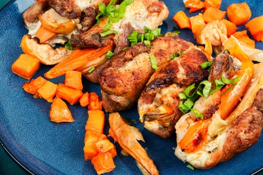 Rolled meat stuffed with apples and sweet potatoes. Space for text.