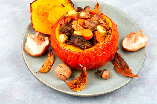 Autumn roasted pumpkin stuffed with beef meat, mushrooms, apple and carrots.