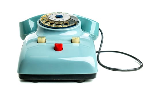 Classic blue rotary phone isolated on a white backdrop, symbolizing retro communication