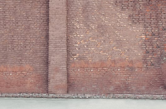 Background texture of an old faded red brick wall with a place for text