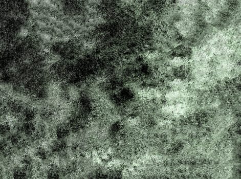 Grunge background of a mottled rough monochrome surface in close-up