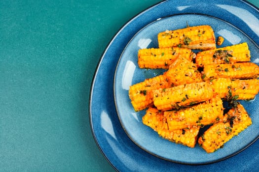 Delicious grilled corn with spices and herbs. Vegetarian food, recipes.