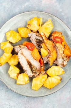 Exotically barbecue, meat roasted with fresh pineapple