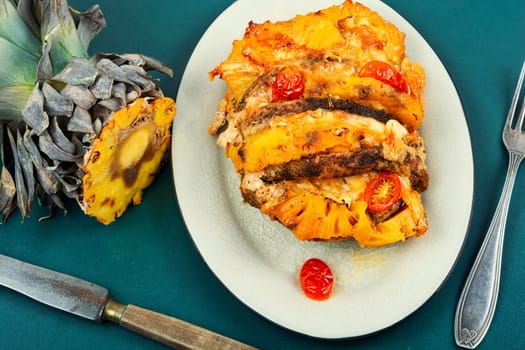 Exotically barbecue, meat roasted with fresh pineapple