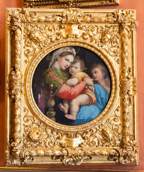 Florence, Italy - 27 June 2023: The Madonna of the Chair, named Madonna della Seggiola, by Raffaello Sanzio, named Raphael, executed c. 1513