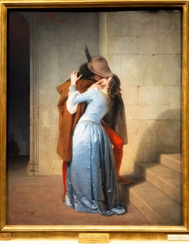 Milan, Italy - 23 September 2023: Brera antique painting museum. The Kiss - Il Bacio - by Francesco Hayez, 1859