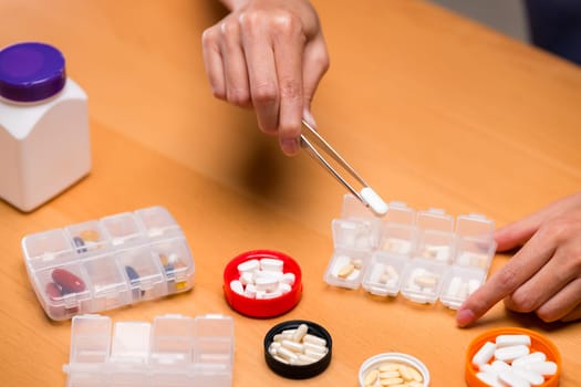 Put medicine on the medical pill box
