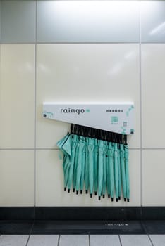 Taipei, Taiwan 26 November 2023: Shared umbrellas "Raingo"" placed outside the MRT station"