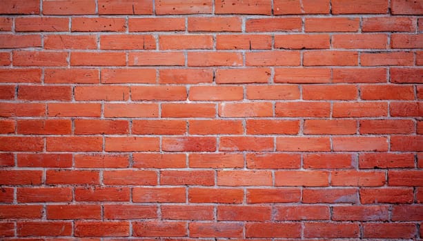 Close up view of a red brick wall. Texture of old dark brown and red brick wall panoramic background. Minimal pattern background concept. Trendy brick wall background idea. Copy space.