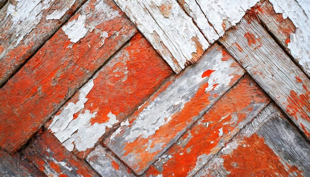 Light blue red and green weathered wooden background with cracked paint.