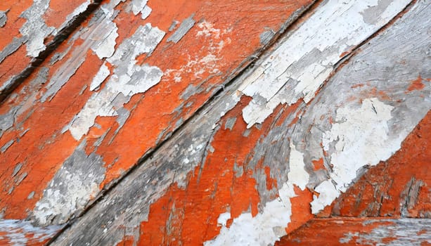 Light blue red and green weathered wooden background with cracked paint.