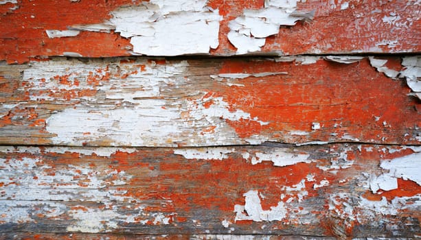 Light blue red and green weathered wooden background with cracked paint.