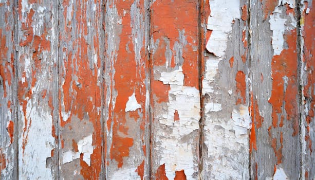 Light blue red and green weathered wooden background with cracked paint.