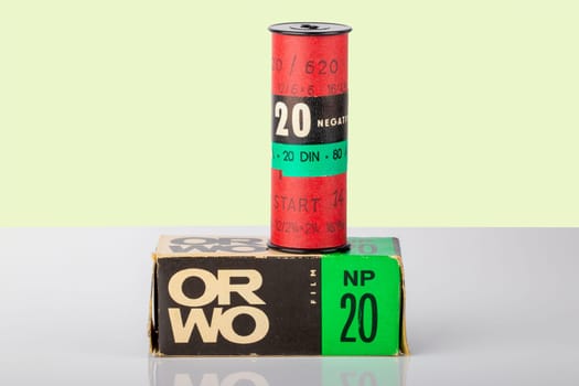Potsdam, Germany - Aug 11, 2018. A old ORWO (Original Wolfen) NP20 (NP= Negative Panchromatic) film roll and its packaging on table over light background. Analogue vintage photography.