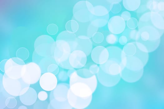 Abstract blurred fresh vivid spring summer light delicate pastel blue turquoise white bokeh background texture with bright circular soft color lights. Card concept. Beautiful backdrop illustration.