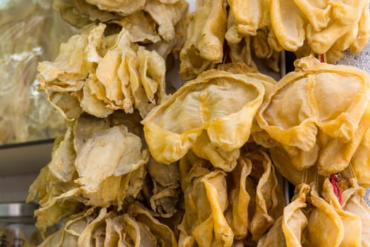 Dry fish maw hanging at the store for selling